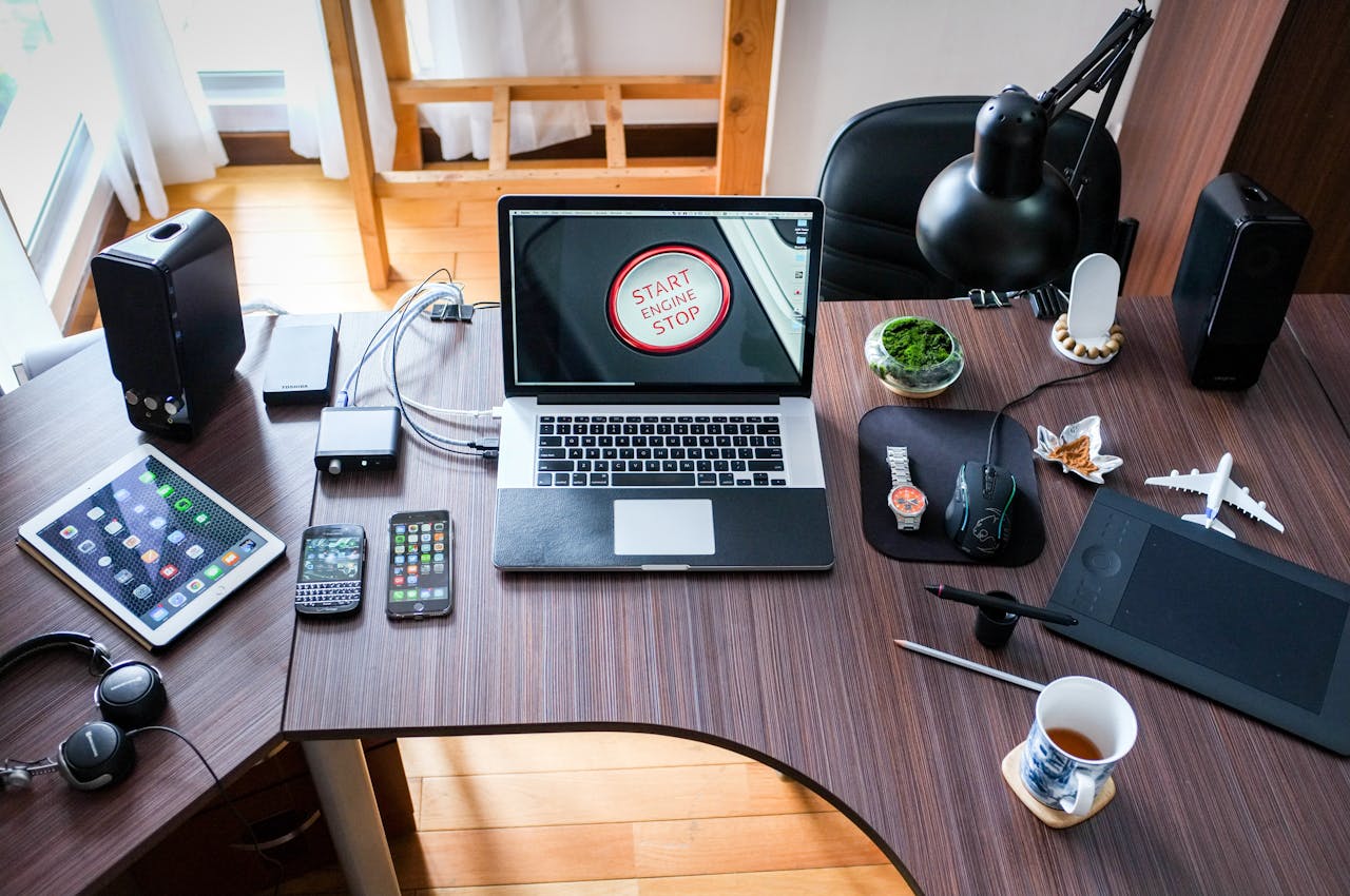 contact-img A contemporary office desk setup with laptops, gadgets, and accessories, creating a tech-savvy workplace.